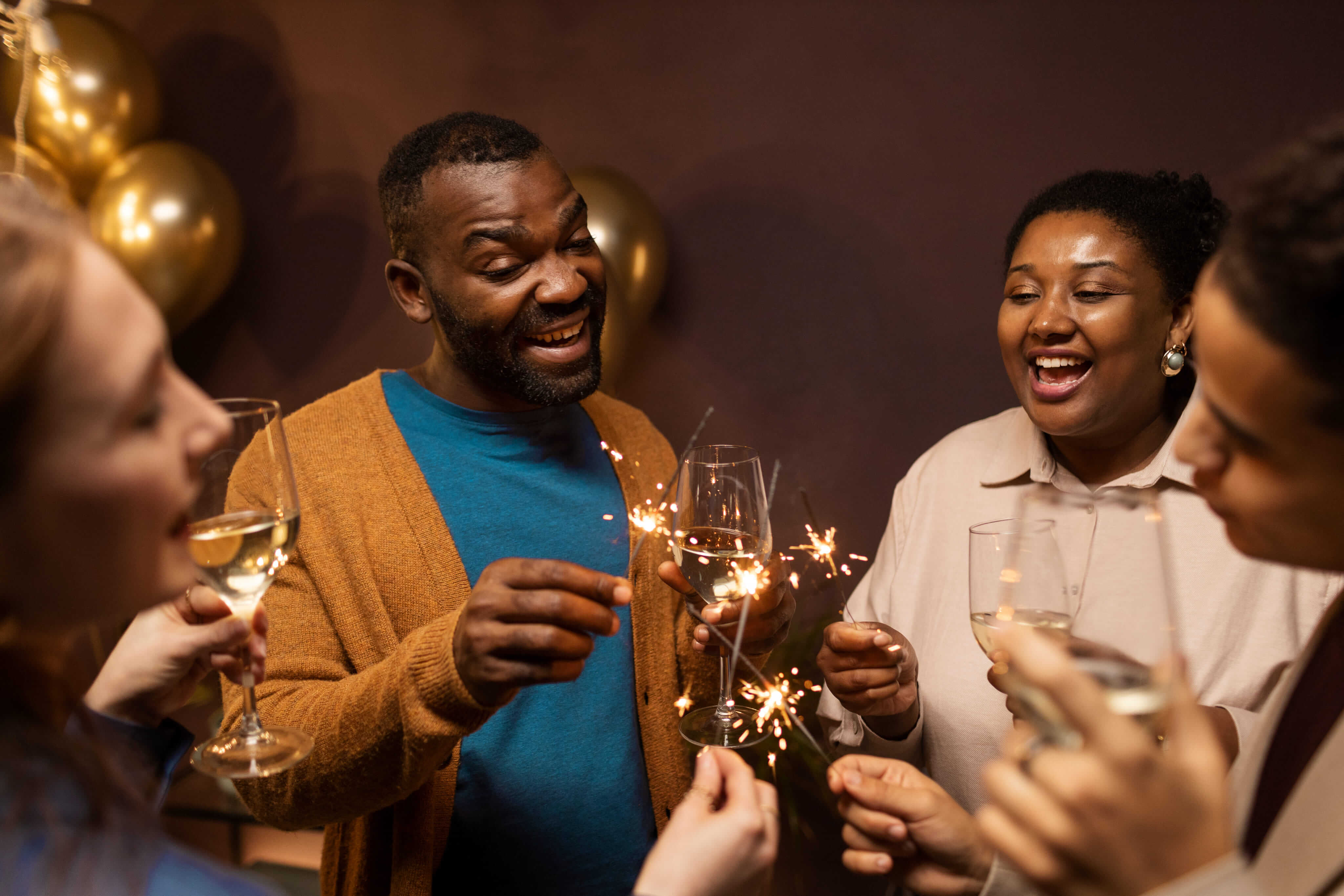 Friends celebrating with sparklers at a Venndor-ticketed event