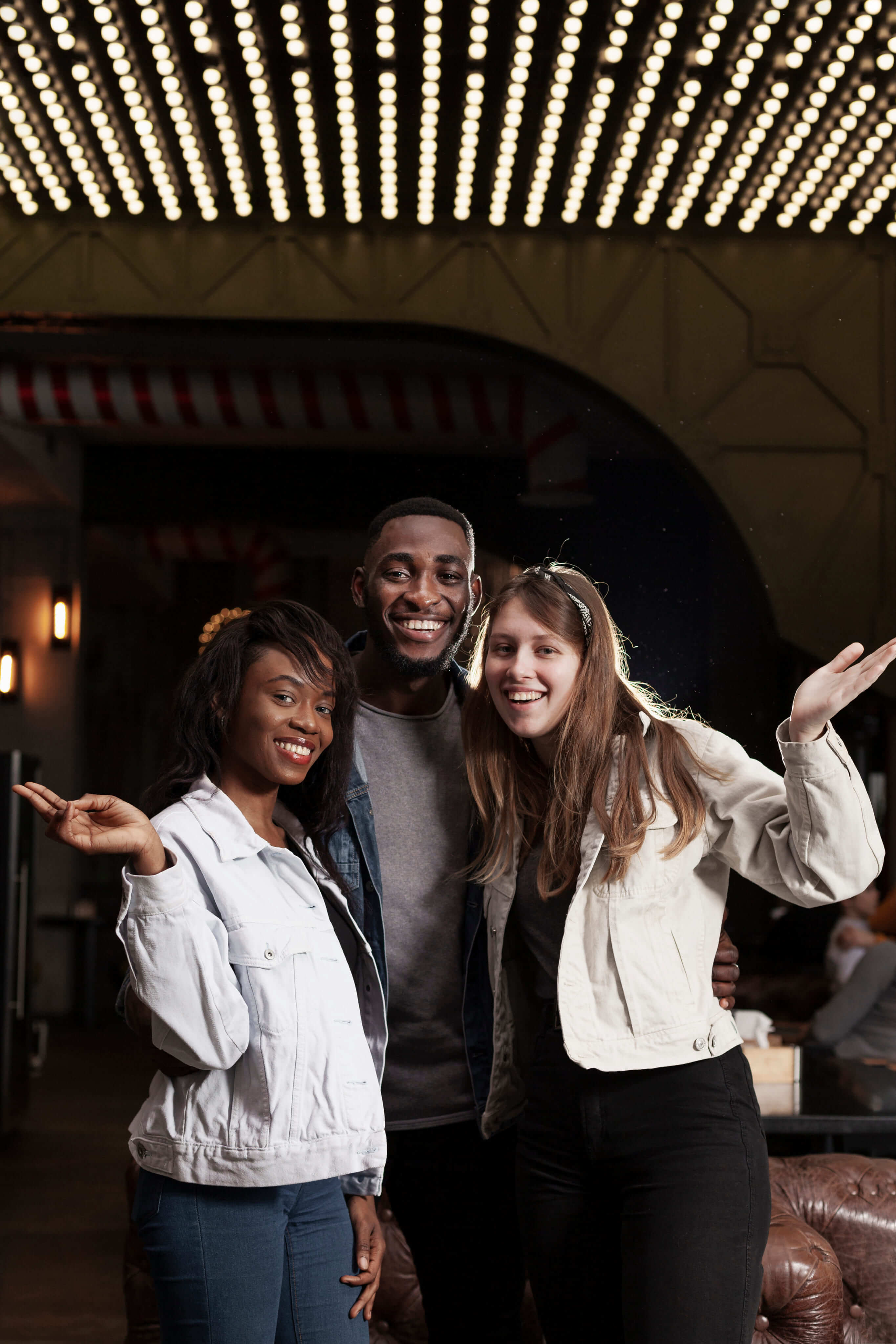 Three smiling friends at a Venndor event